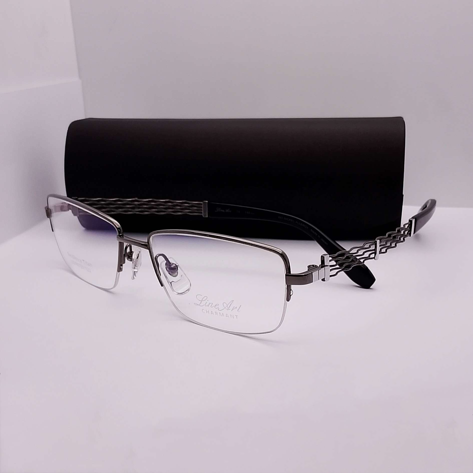 XL2307 Line Art by Charmant Titanium Half Rim