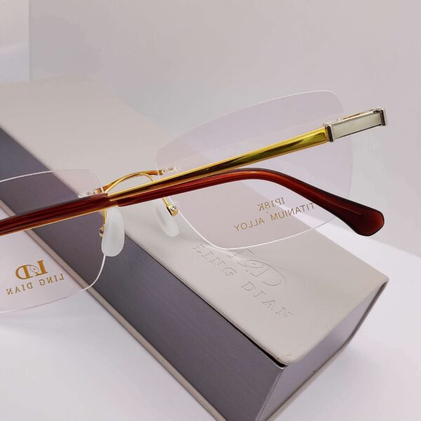 Ling Dian titanium rimless eyeglasses in rose gold, Nine Optic