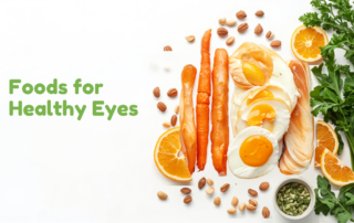 Flat-lay of eye-healthy foods — carrots, eggs, fish, leafy greens, oranges and nuts (chokher jonno bhalo khabar) in Bangladesh